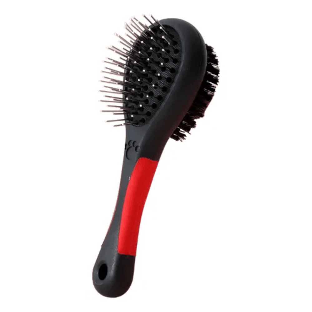 Black and red pet grooming brush on a white background