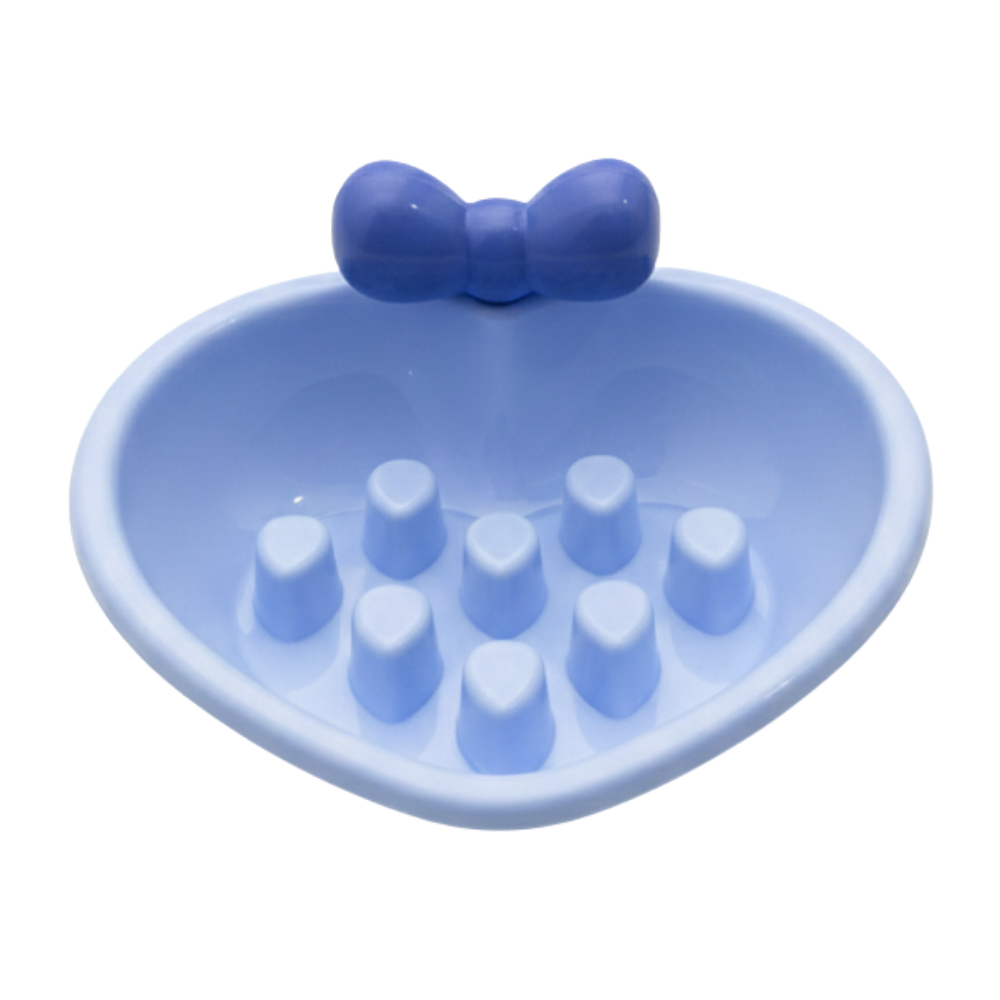 Blue silicone dish with a bow on a white background