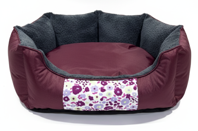 Pet bed with floral patch on a white background