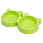 Green pet bowl with cat ears on a white background