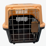 Pet carrier with orange top and black interior on a white background