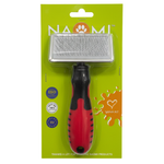 Pet grooming brush with red handle and black bristles on a green packaging background