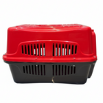 Red and black pet carrier on a white background
