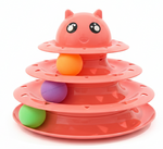 Pink cat toy with three tiers and colorful balls on a white background