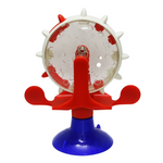 Red and blue plastic toy with a white central wheel on a white background