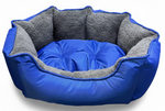 Blue pet bed with gray interior on a white background