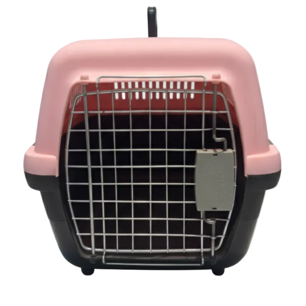 Pink pet carrier with a grid door on a white background