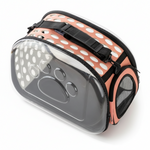 Pet carrier with polka dot design on a white background