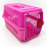 Pink pet carrier with a white background