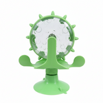 Green pet toy with a transparent center on a white background