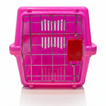 Pink pet carrier with a red door on a white background