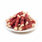 Plate of raw meat sticks on a white background