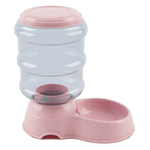 Pink and clear pet feeder on a white background