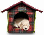 Plaid dog house with a puppy inside on a white background