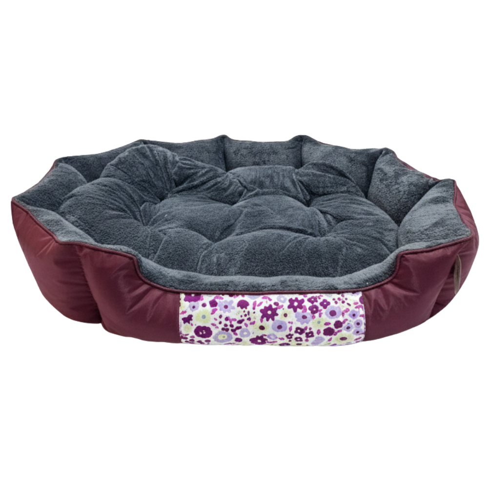 Round pet bed with floral patterned strip on a white background