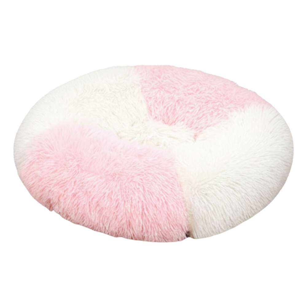 Round pink and white fluffy cushion on a white background