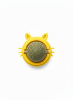 Yellow cat-shaped toy with a green ball inside on a white background