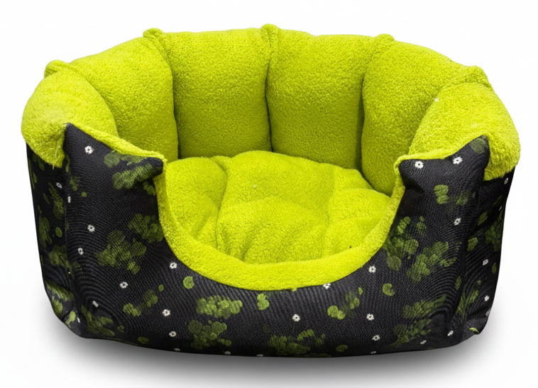 Pet bed with green interior and black exterior with white patterns on a white background