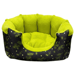 Pet bed with green interior and black exterior with white patterns on a white background