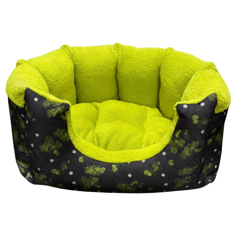 Pet bed with green interior and black exterior with white patterns on a white background