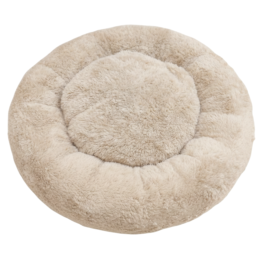 Round beige pet bed on a white background