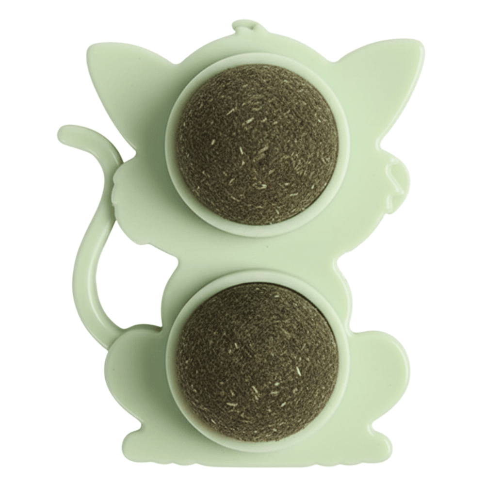 Green silicone tea infuser with two compartments on a white background