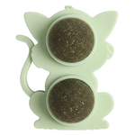 Green silicone tea infuser with two compartments on a white background