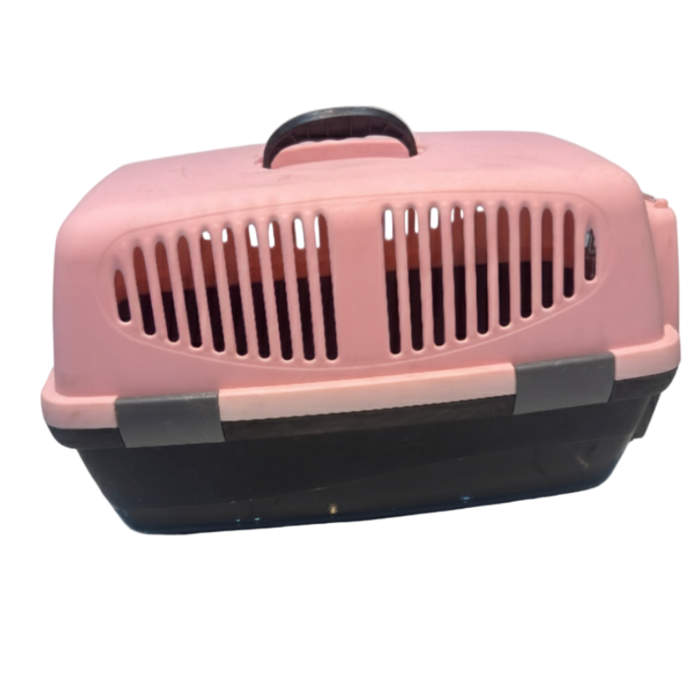 Pink and black pet carrier on a white background