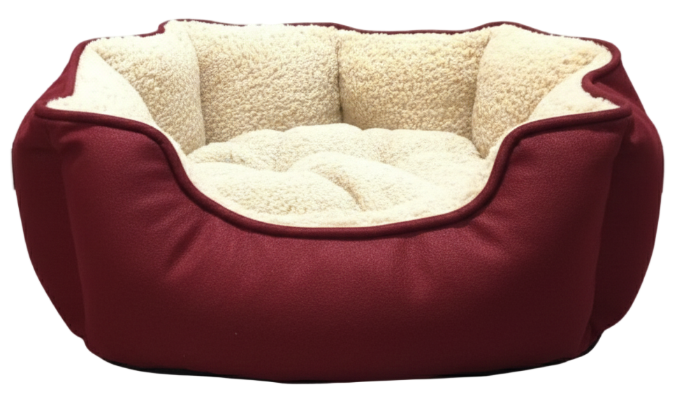 Red pet bed with beige interior on a light gray background