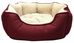 Red pet bed with beige interior on a light gray background