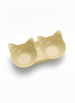Cat-shaped double bowl on a white background