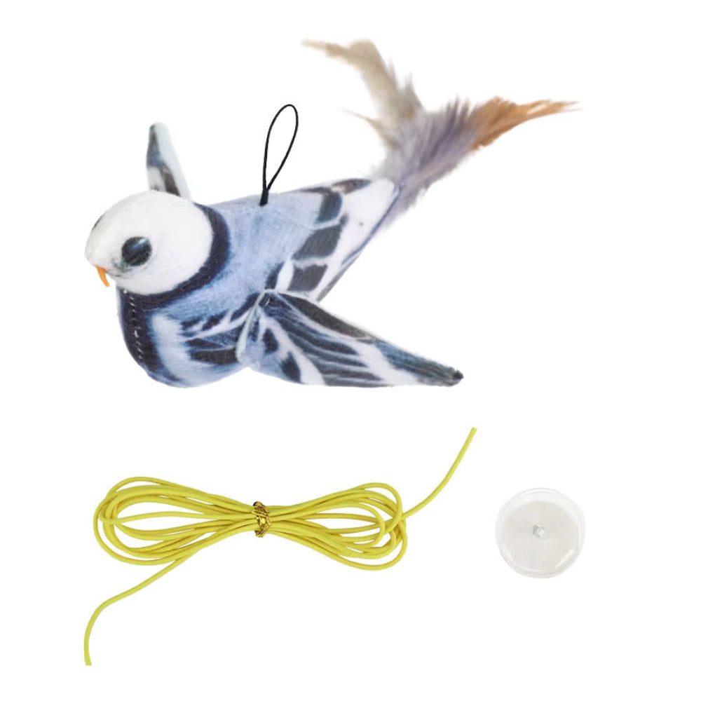 Toy bird with a string and suction cup on a white background