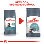 Two packages of Royal Canin Hairball Care cat food with a red arrow and text indicating a new look and upgraded formula.