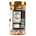 Jar of dog treats with a gold lid on a white background