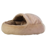 Beige pet bed with a soft texture on a white background