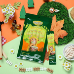 Moochle pet food packages on a colorful background with decorative elements