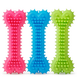 Three colorful bone-shaped dog toys with textured surfaces on a white background