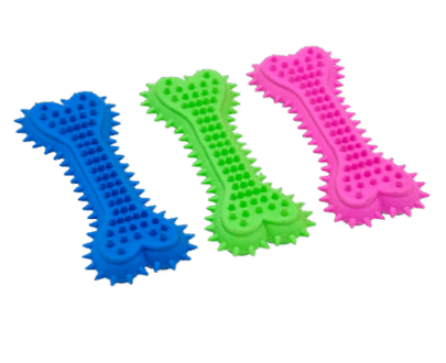 Three colorful dog toys shaped like bones on a white background