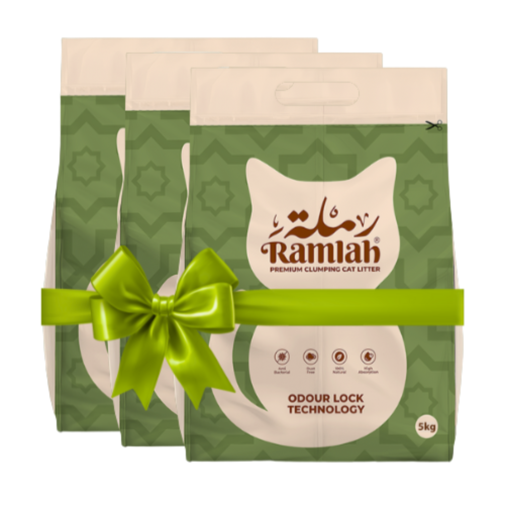 Two packages of Ramlah cat litter with a green bow on a white background