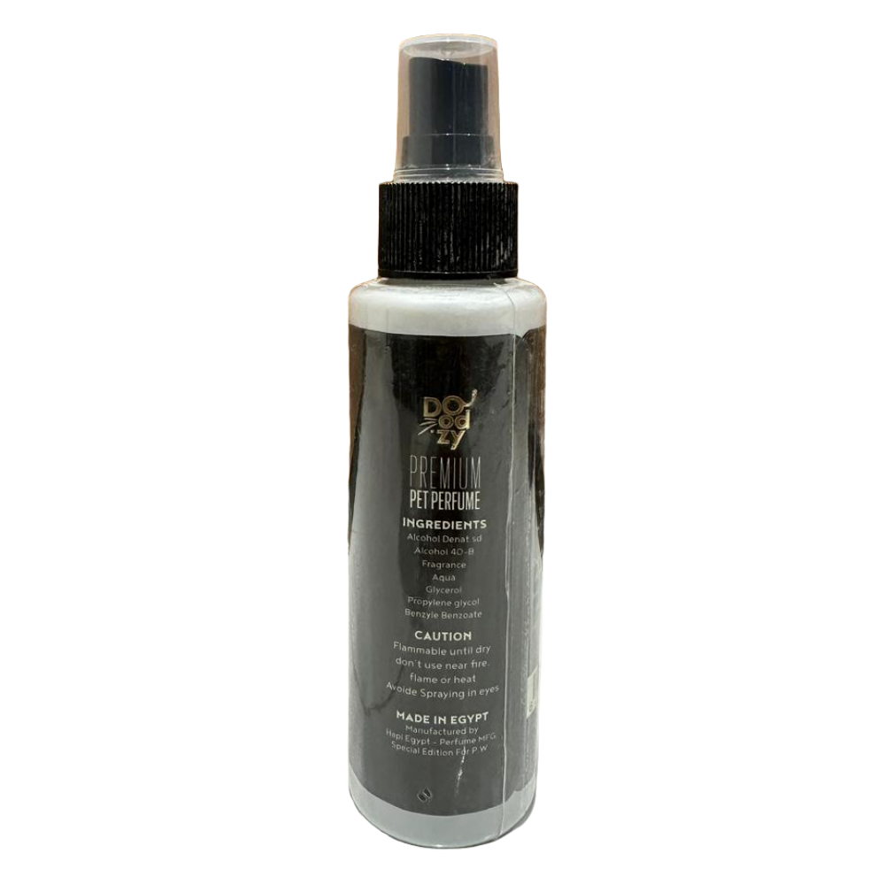 Spray bottle with black and white label on a tiled floor with wooden wall background