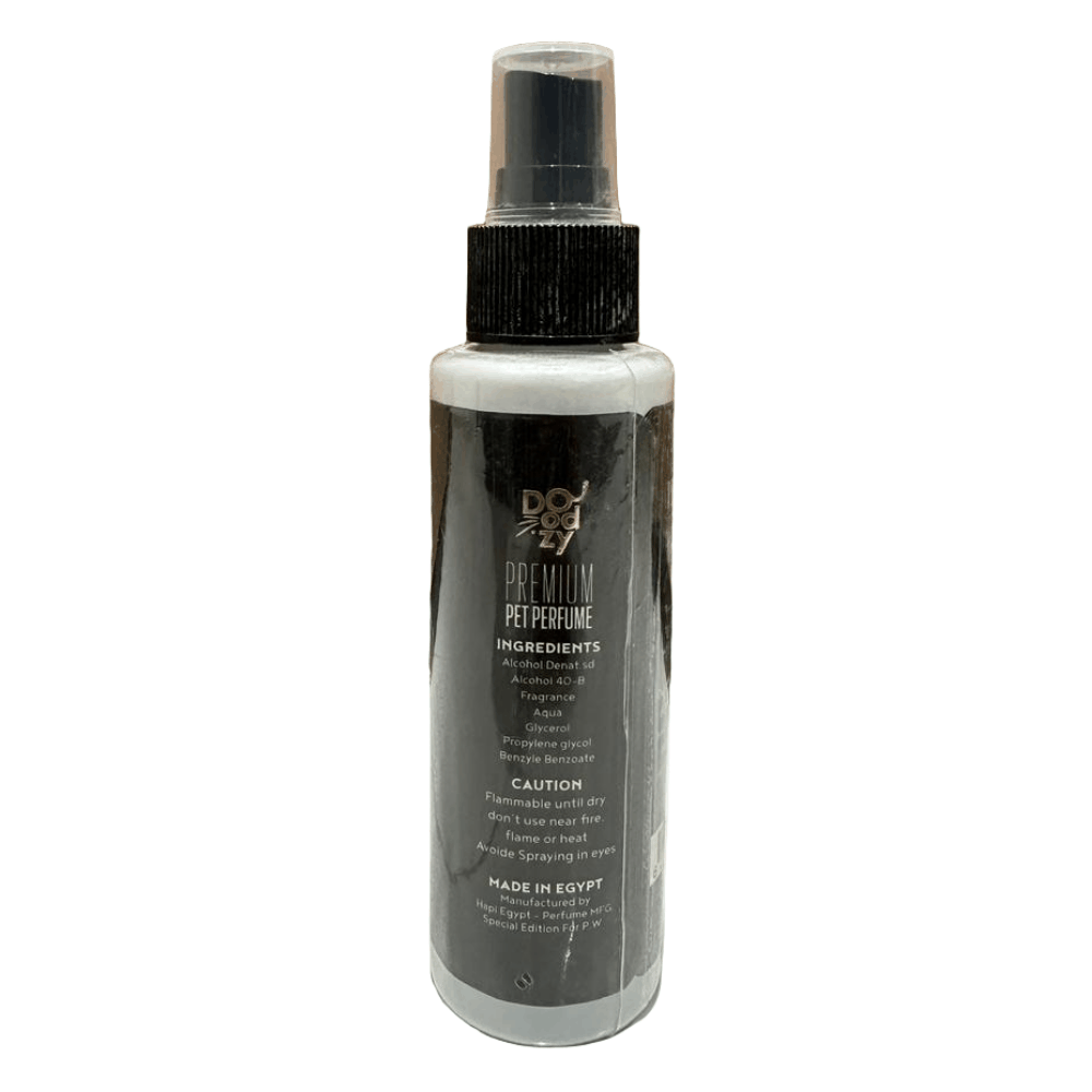 Spray bottle with black and white label on a tiled floor with wooden wall background