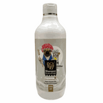 Dog shampoo bottle with a label featuring cartoon dogs on a wooden surface.