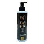 Doggy Woof Wash premium pet shampoo bottle on a tiled floor with wooden wall background