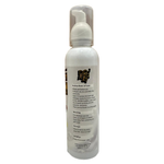 White spray bottle with label on a wooden surface