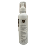 White spray bottle with label on a wooden surface