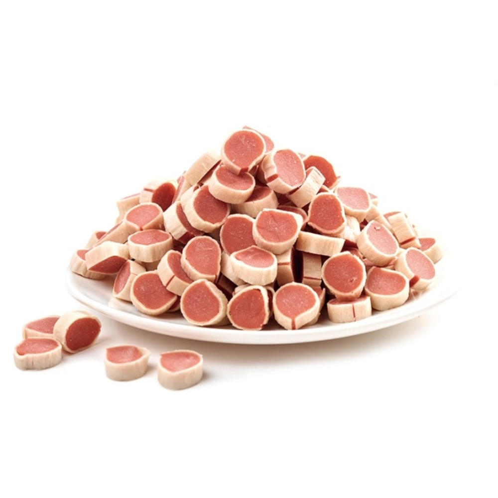 Platter of sliced raw meat on a white background