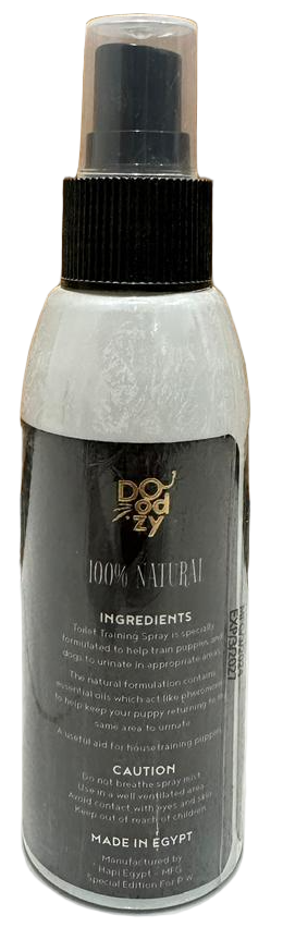 Spray bottle labeled 'Body Naturals' on a tiled floor with wooden wall background