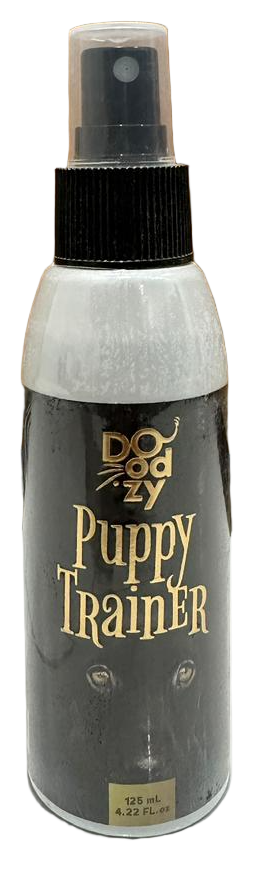 Bottle of Puppy Trainer spray on a tiled floor with wooden wall background