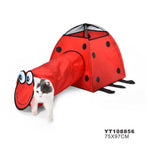 Red ladybug-shaped pet play tunnel with a cat peeking out on a white background