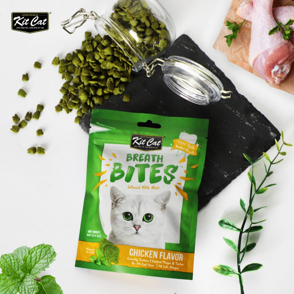 Kit Cat Breath Bites Chicken Flavor cat treat package with green herbs on a white background
